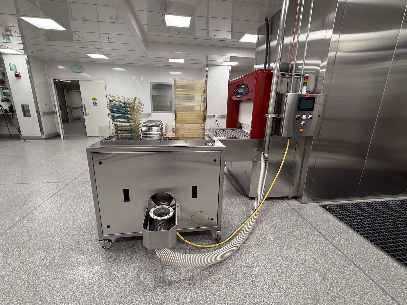 Pneumatic conveying lines routed through facility